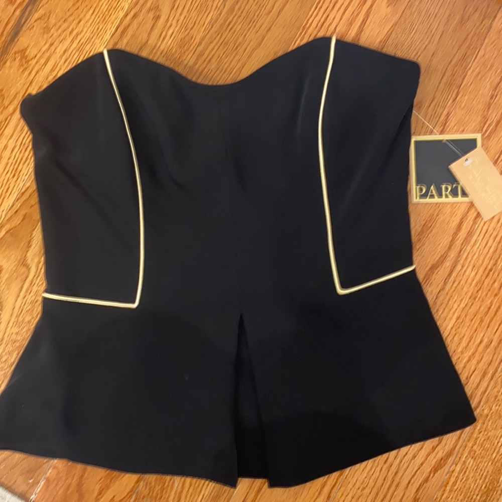 Tube top with gold accent.  Corset boning inside.